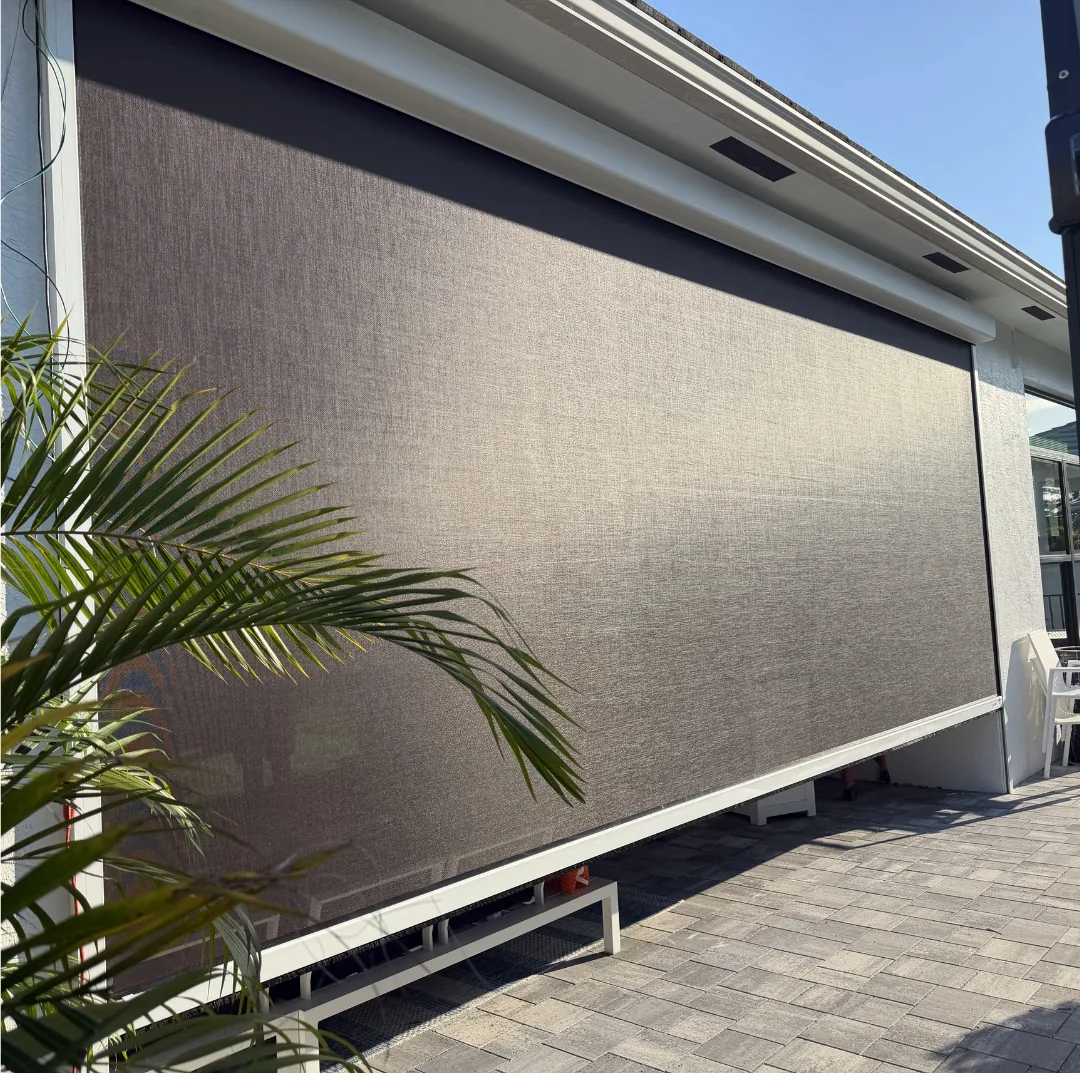 Solar roller shades on sliding glass doors with pool view South Florida home